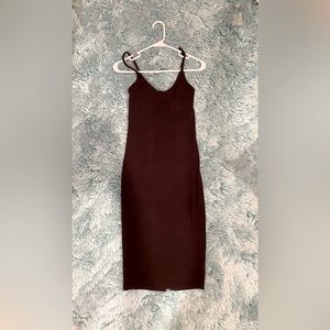 Stylish black cocktail dress, perfect for formal or semi-formal occasions.